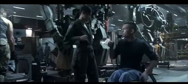 a group of men standing around each other in a room