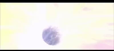 a blurry picture of a circular object in the sky