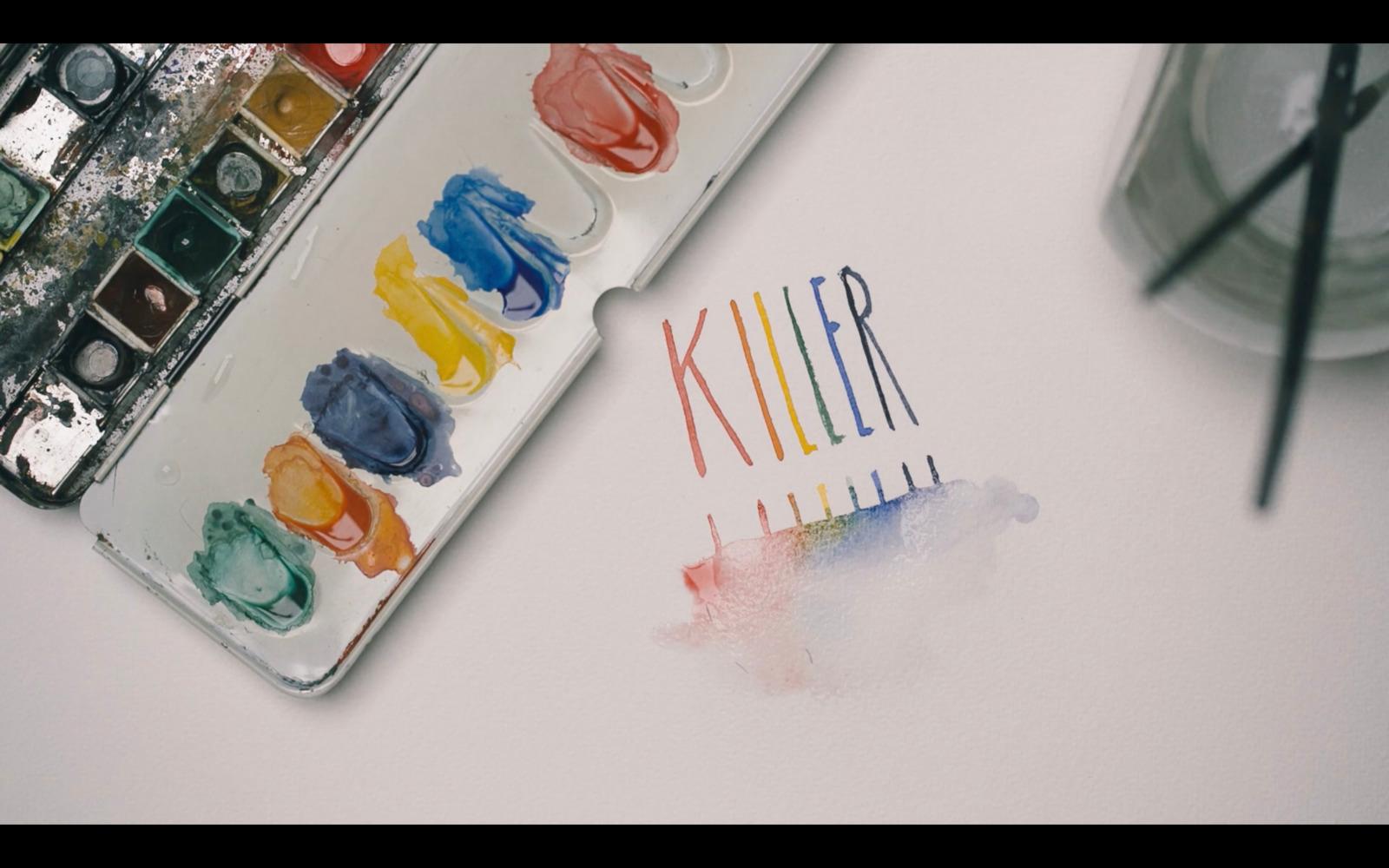 a close up of a paint palette and a knife
