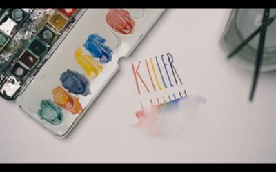 a close up of a paint palette and a knife