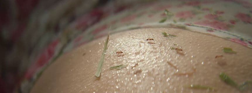 a close up of a woman's butt with a lot of dirt on it