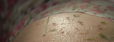 a close up of a woman's butt with a lot of dirt on it