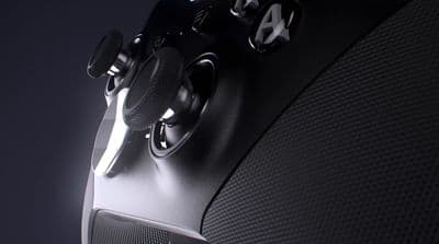 a close up of a black video game controller