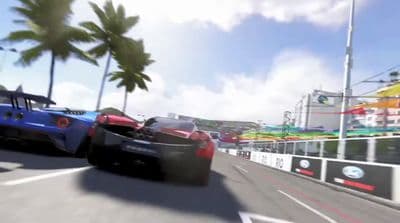 two racing cars driving down a race track