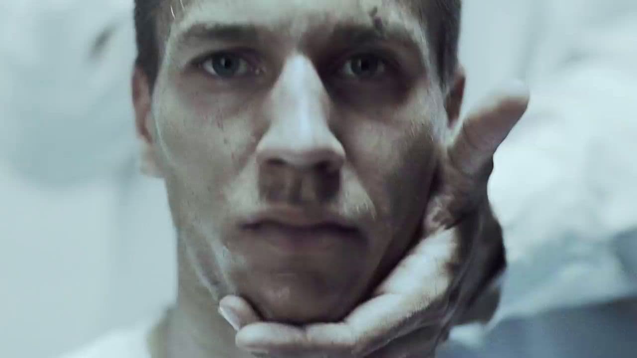 a man with his hand on his face