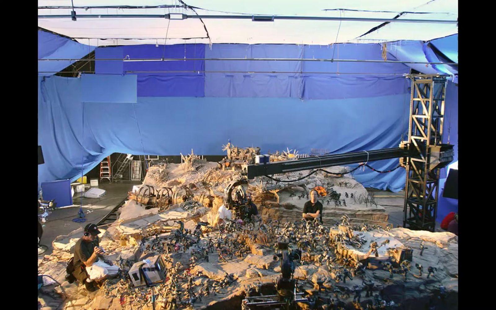 a large pile of rubble sitting under a blue tarp