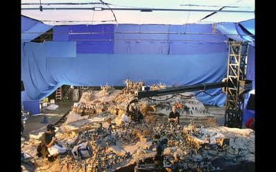 a large pile of rubble sitting under a blue tarp