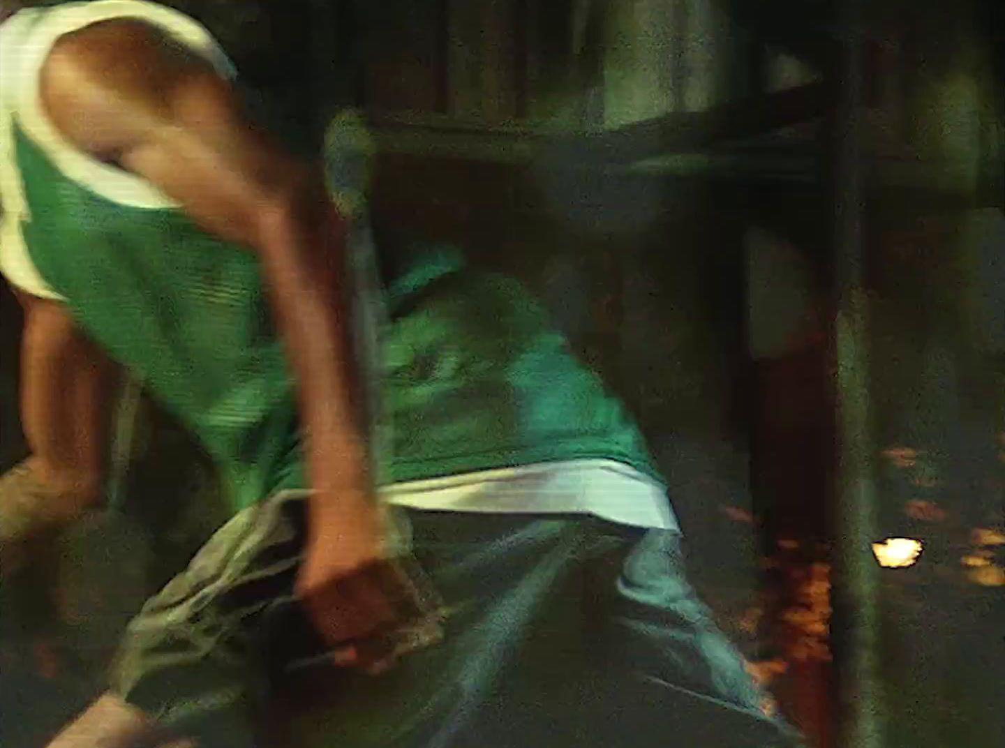 a man in a green shirt is skateboarding