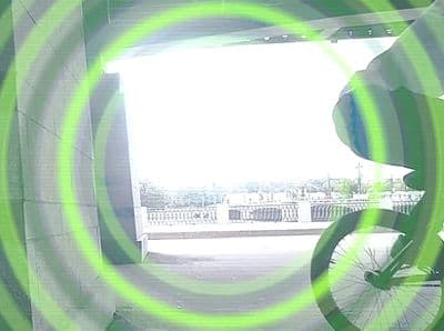 a man riding a bike through a tunnel