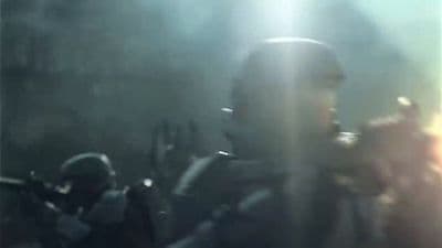 a blurry photo of a man holding a gun