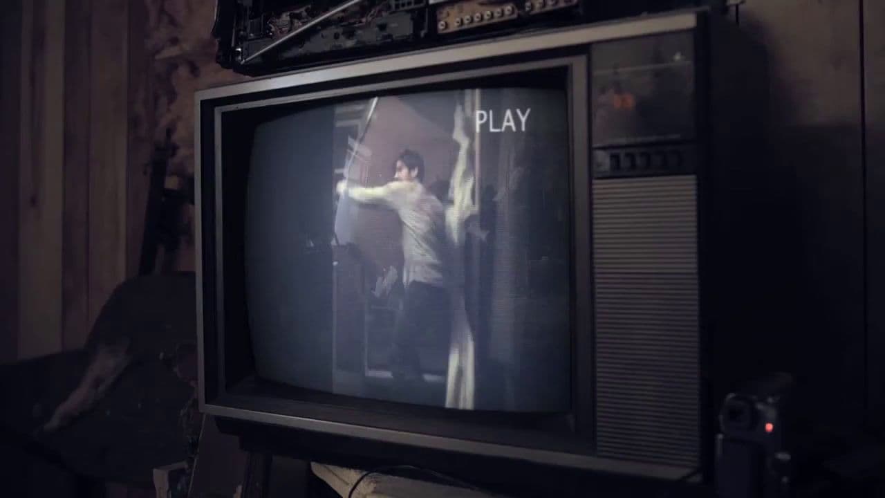 a man standing in front of a tv playing a game