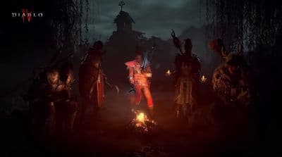 a group of people standing around a fire