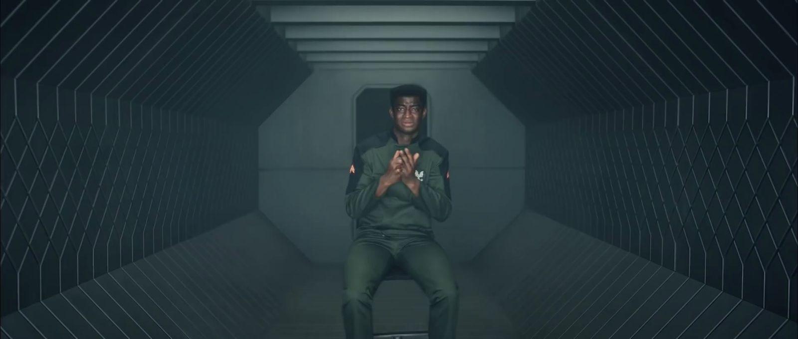 a man sitting on a chair in a tunnel
