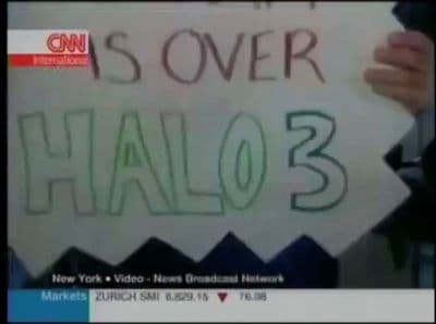 a person holding a sign with writing on it