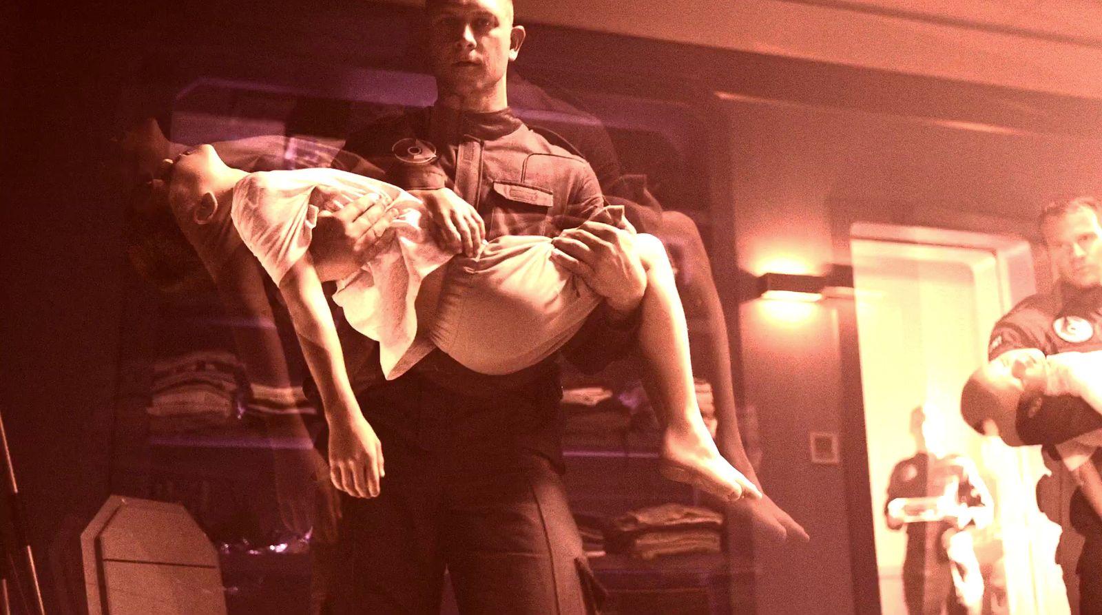 a man holding a woman in his arms