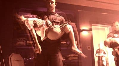 a man holding a woman in his arms