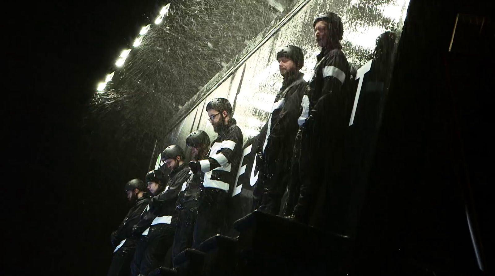 a group of men standing next to each other