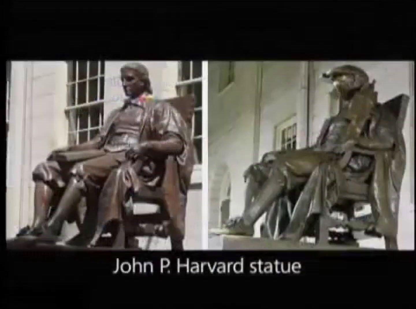 a statue of a man sitting in a chair