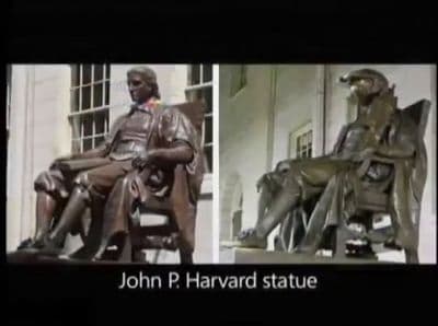 a statue of a man sitting in a chair