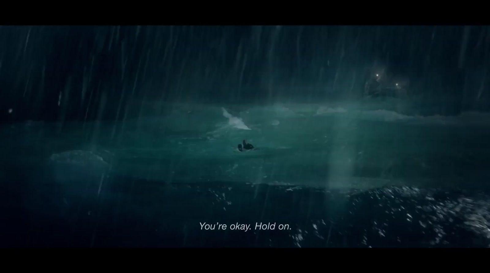 a boat floating in the middle of a dark ocean