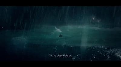 a boat floating in the middle of a dark ocean