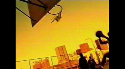 a man is doing a trick on a basketball hoop
