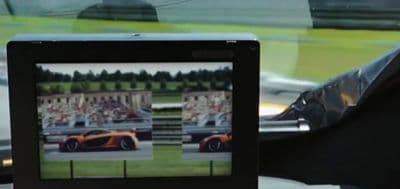 a picture of a sports car in a car mirror