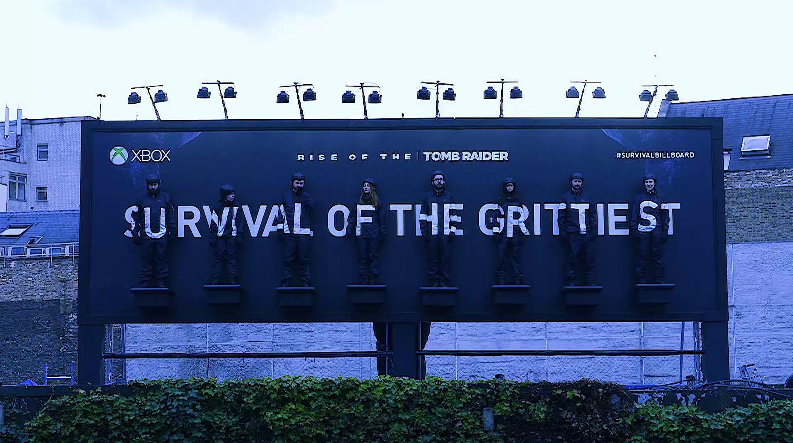 a billboard with the words survival of the grittest on it