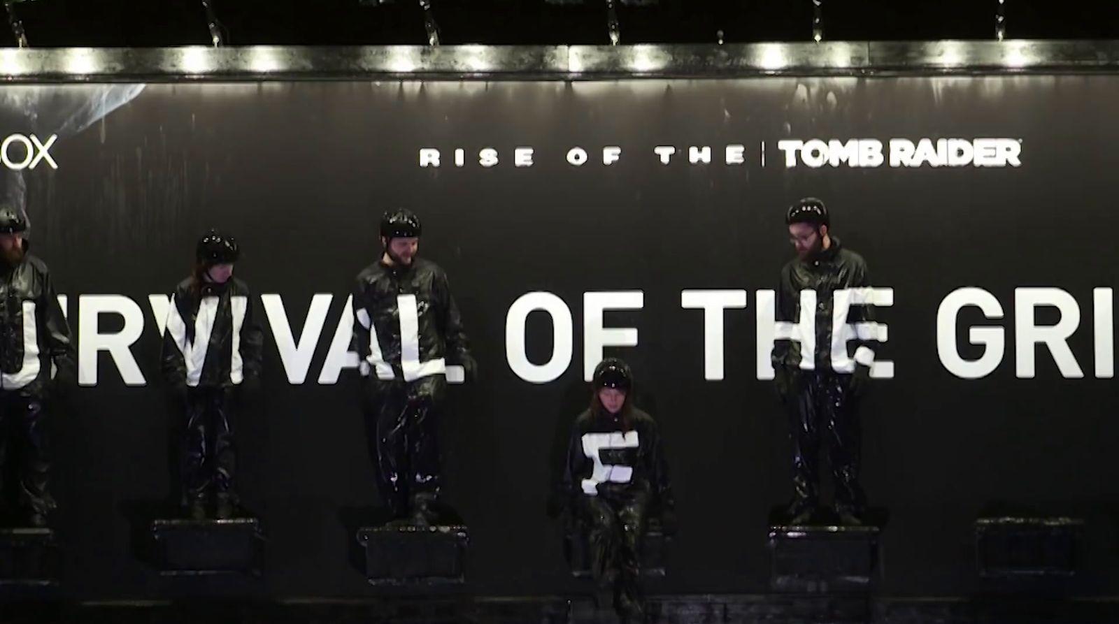 a group of people standing in front of a sign