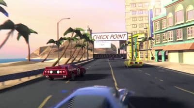 a red car driving down a street next to tall buildings