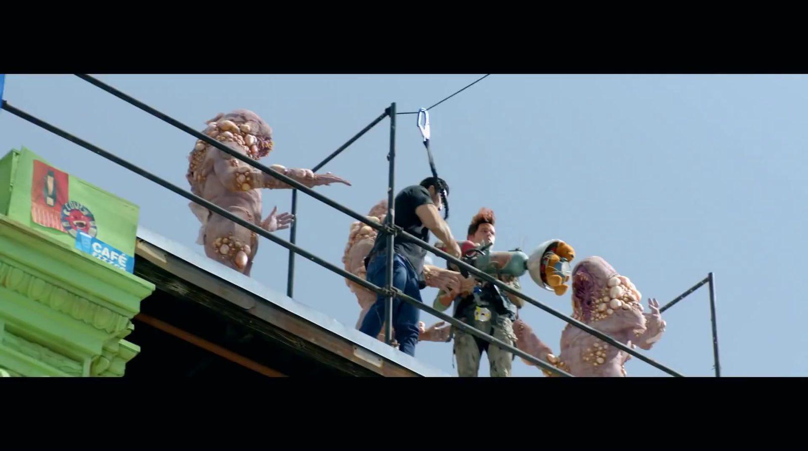 a group of people standing on top of a building