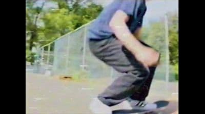 a man riding a skateboard down the side of a ramp