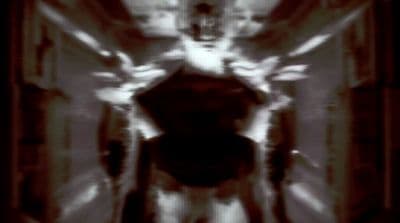 a blurry photo of a person walking down a hallway