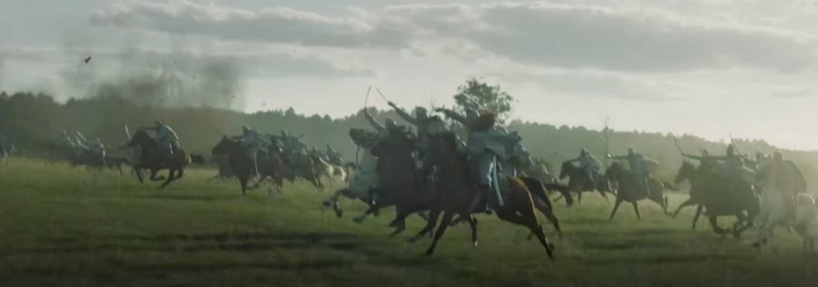 a group of men riding on the backs of horses