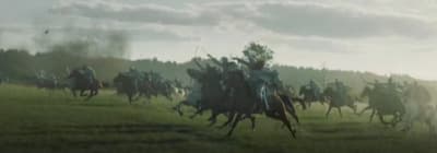 a group of men riding on the backs of horses