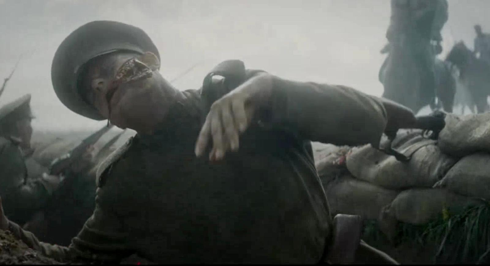 a man in a helmet pointing at something