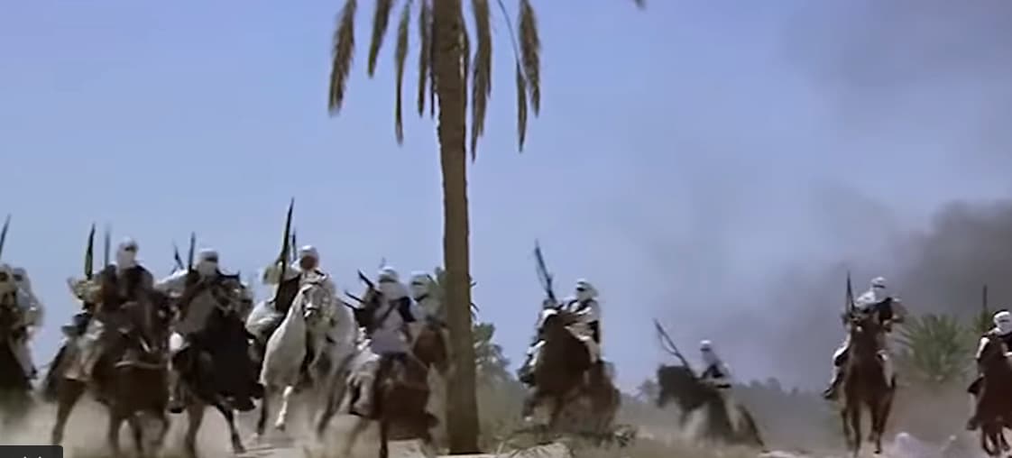 a group of men riding on the backs of horses