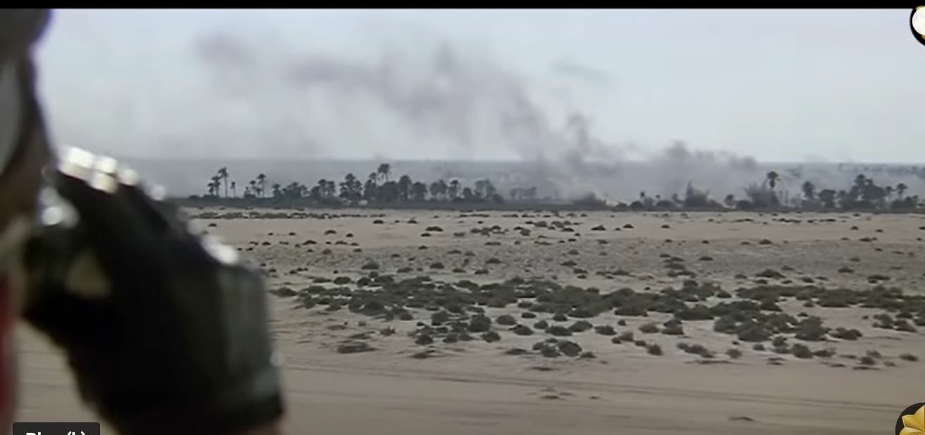 a large amount of smoke is coming out of a field