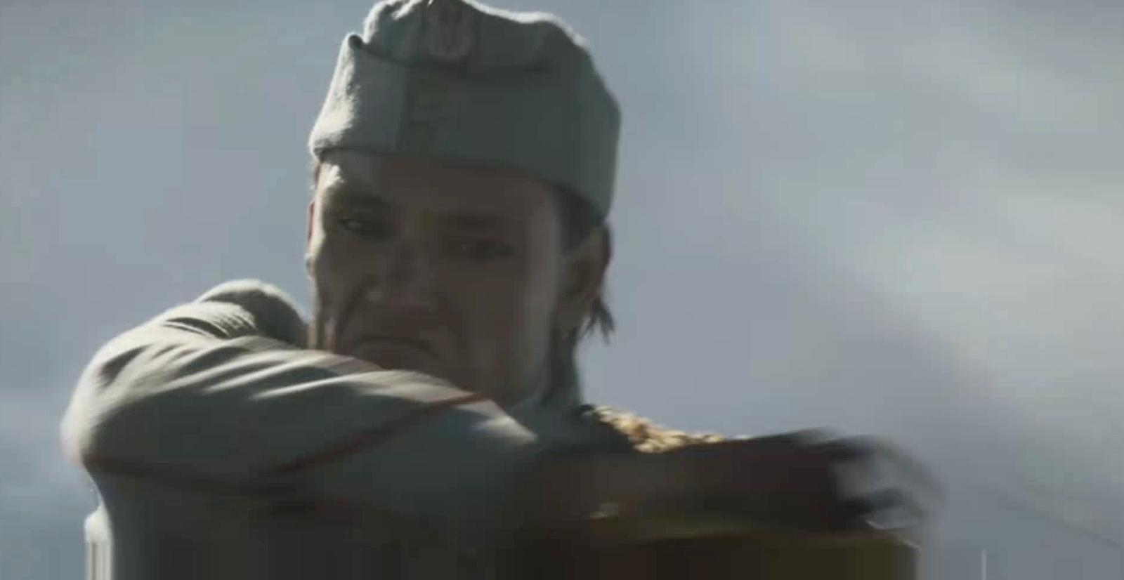 a man with a hat and a scarf around his neck