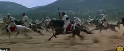 a group of men riding on the backs of horses