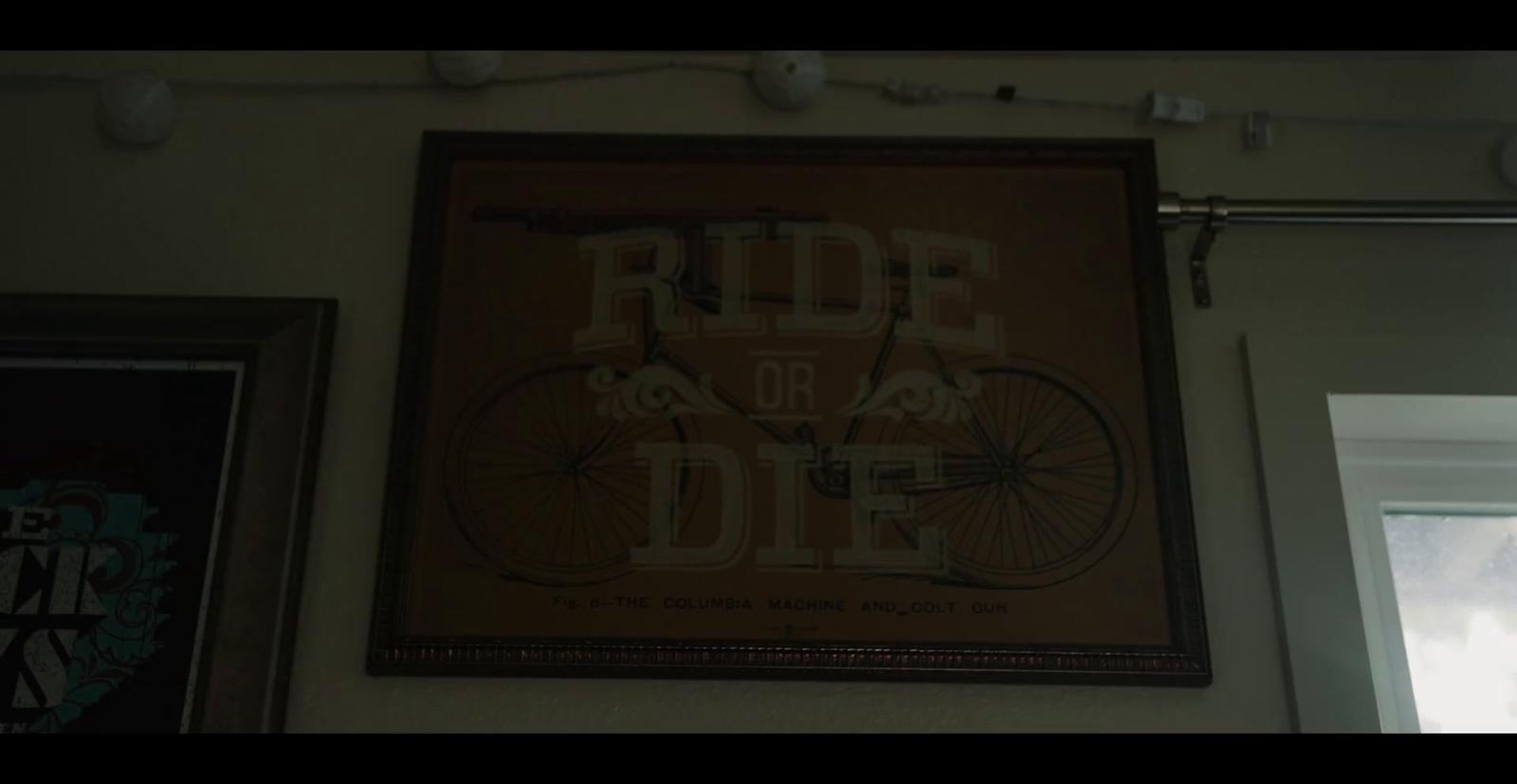 a picture of a bicycle hanging on a wall