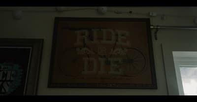 a picture of a bicycle hanging on a wall