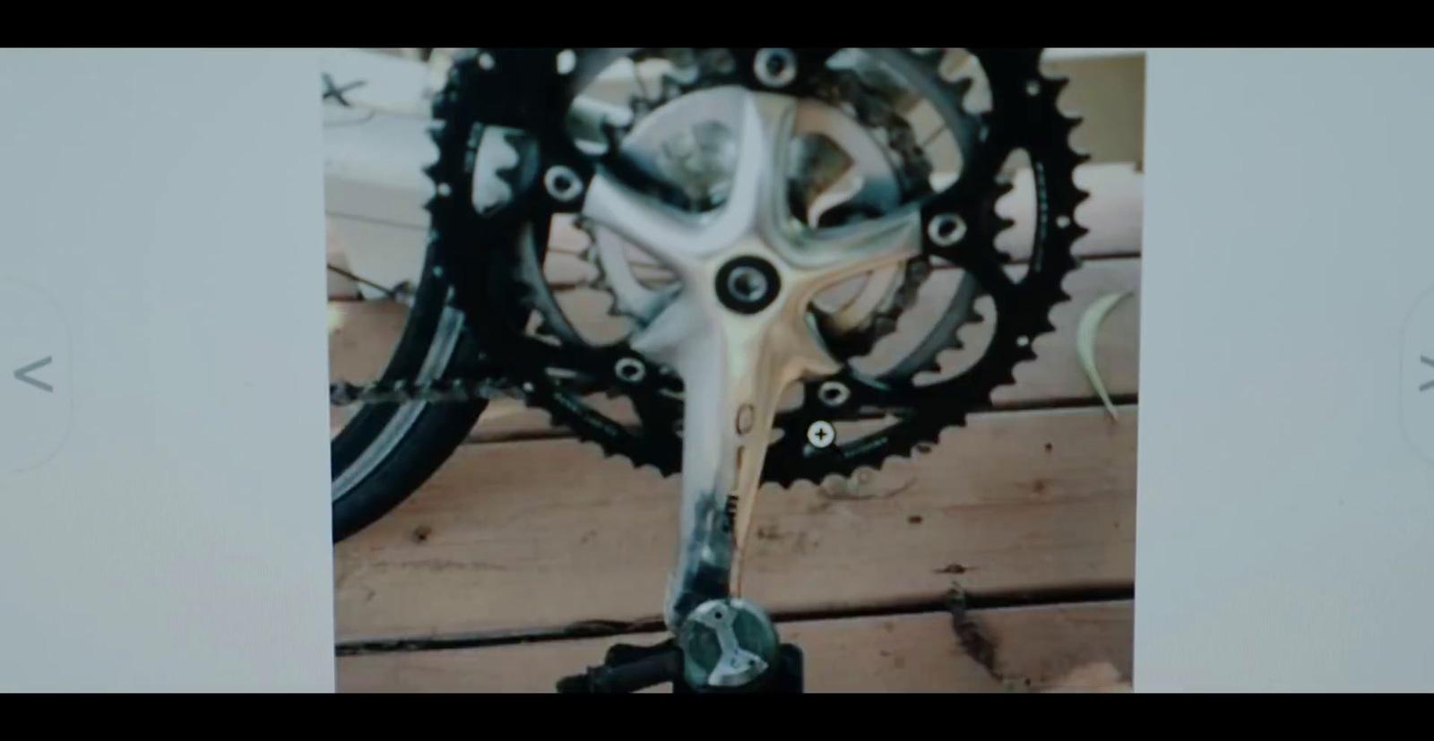 a close up of a bike's gear on a wooden floor