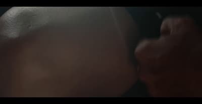a close up of a person kissing another person
