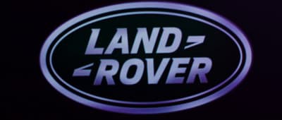 a black and white sign that says land rover