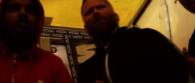 a couple of men standing next to each other