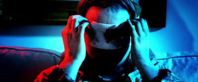 a woman covering her face with her hands