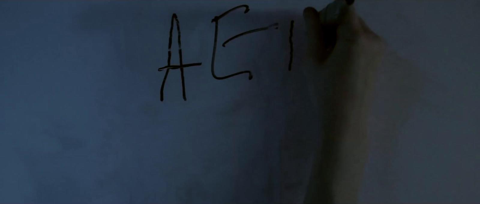 a white wall with writing written on it