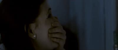 a woman covering her face with her hands