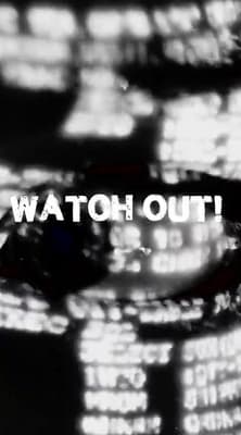 a close up of a clock with the words watch out